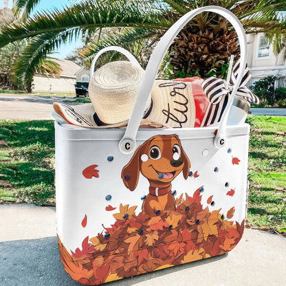 Spheregoods Cee™ Bag Puppy with a pile of autumn leaves