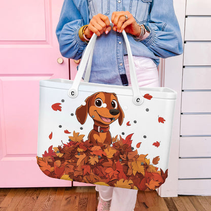 Spheregoods Cee™ Bag Puppy with a pile of autumn leaves