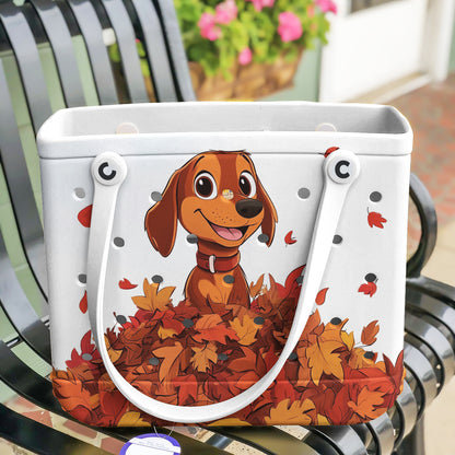 Spheregoods Cee™ Bag Puppy with a pile of autumn leaves